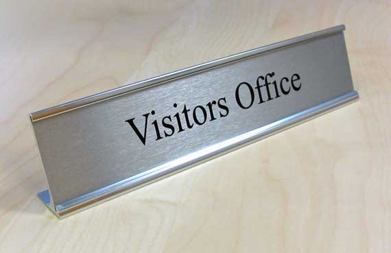 Desktop office signs and contemporary reception counter signage.