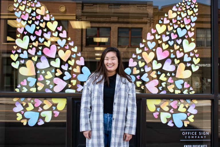 Kali Vinson poses in front of our downtown Fargo location.